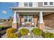Inviting front porch with comfortable seating and decorative landscaping at 12073 Springtide Ln, Fishers, IN 46037