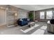 Stylish living room featuring wood panel accent wall and comfortable seating at 12073 Springtide Ln, Fishers, IN 46037