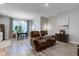 Open-concept living room with a cozy reclining sofa and natural light for comfortable living at 12073 Springtide Ln, Fishers, IN 46037