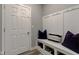 Functional mudroom with built-in bench, storage shelves, and hooks for organized entry at 12073 Springtide Ln, Fishers, IN 46037