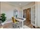 Bright home office with a modern desk, shelving, and natural light at 12073 Springtide Ln, Fishers, IN 46037