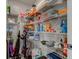Pantry featuring wire shelving stocked with household items at 12073 Springtide Ln, Fishers, IN 46037
