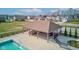 Poolside pavilion featuring tables, chairs, and a covered area surrounded by well-manicured green spaces at 12073 Springtide Ln, Fishers, IN 46037