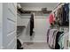 Walk-in closet with hanging clothes and clothing rack at 12073 Springtide Ln, Fishers, IN 46037