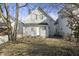 A view of the backyard with the rear side of a gray home at 1211 W 30Th St, Indianapolis, IN 46208