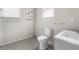 Neutral bathroom featuring modern fixtures, updated flooring, and shelving at 1211 W 30Th St, Indianapolis, IN 46208