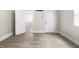 Bright living room showcasing the neutral walls, flooring, and natural light streaming in from a nearby room at 1211 W 30Th St, Indianapolis, IN 46208