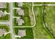 An aerial shot showcases a home's proximity to walking trails and a scenic greenway at 12127 Whisper Ridge Dr, Noblesville, IN 46060