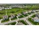 An aerial view of a well manicured housing community with multiple sidewalks and a pond at 12127 Whisper Ridge Dr, Noblesville, IN 46060