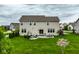 A large backyard with a patio area is ideal for outdoor entertaining at 12127 Whisper Ridge Dr, Noblesville, IN 46060