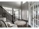 Spacious foyer featuring high ceilings, dark wood floors, area rug, and view into dining area at 12127 Whisper Ridge Dr, Noblesville, IN 46060