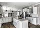 Bright kitchen with a center island, granite countertops, and modern appliances at 12127 Whisper Ridge Dr, Noblesville, IN 46060