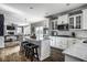 Open kitchen featuring a large island, stainless appliances, and adjacent dining area at 12127 Whisper Ridge Dr, Noblesville, IN 46060