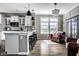Kitchen with white cabinets, granite countertops, and view to a seating area at 12127 Whisper Ridge Dr, Noblesville, IN 46060