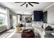 Spacious living room seamlessly connecting to kitchen and dining areas, bathed in natural light at 12127 Whisper Ridge Dr, Noblesville, IN 46060