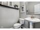 Well-lit powder room featuring modern fixtures and tasteful decor at 12127 Whisper Ridge Dr, Noblesville, IN 46060