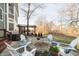 Backyard area with a stone fire pit, seating, and hot tub offers an inviting outdoor retreat at 12433 Harvest Glen Blvd, Fishers, IN 46037