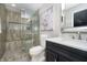 This bathroom features tiled glass shower, stylish vanity and neutral color palette, creating a luxurious, relaxing space at 12433 Harvest Glen Blvd, Fishers, IN 46037