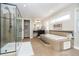 This bathroom features a walk in shower and soaking tub at 12433 Harvest Glen Blvd, Fishers, IN 46037