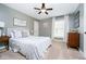 This bedroom features carpet flooring and a ceiling fan at 12433 Harvest Glen Blvd, Fishers, IN 46037