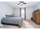 This bedroom features carpet flooring and a ceiling fan at 12433 Harvest Glen Blvd, Fishers, IN 46037