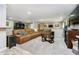 This living room features a sectional couch and tv at 12433 Harvest Glen Blvd, Fishers, IN 46037