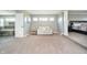Spacious main bedroom with a sitting area, plush carpet, and serene color palette at 12433 Harvest Glen Blvd, Fishers, IN 46037