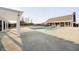A refreshing pool with ample concrete patio space is ready for the coming warmer months with neighborhood homes in the background at 12433 Harvest Glen Blvd, Fishers, IN 46037