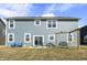 Spacious backyard featuring a new home with a patio, seating, and a swing set at 1399 Hat Band St, Danville, IN 46122