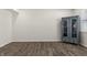 Clean basement area with hardwood floors, a window and a blue cabinet at 1399 Hat Band St, Danville, IN 46122