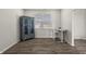 Functional basement with hardwood floors, cabinet and a table with chairs at 1399 Hat Band St, Danville, IN 46122