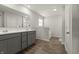 Bright bathroom with a double vanity, wood-look floors, and ample space for a relaxing experience at 1399 Hat Band St, Danville, IN 46122