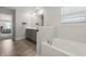 Bright bathroom featuring a soaking tub, double vanity, and modern fixtures at 1399 Hat Band St, Danville, IN 46122