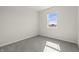 Simple bedroom with a large window and carpet flooring at 1399 Hat Band St, Danville, IN 46122
