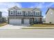 Beautiful two-story home featuring a two-car garage, brick accents, and neutral gray siding at 1399 Hat Band St, Danville, IN 46122