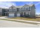 Charming two-story home with a two-car garage, brick accents, and a well-maintained lawn at 1399 Hat Band St, Danville, IN 46122