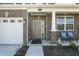 Inviting front porch with brick columns, seating, and a view of the manicured front yard at 1399 Hat Band St, Danville, IN 46122