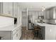 Modern kitchen featuring stainless steel appliances, gray cabinetry, quartz countertops, and a breakfast bar at 1399 Hat Band St, Danville, IN 46122