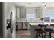 Modern kitchen with stainless steel appliances, center island and sliding door leading to the backyard at 1399 Hat Band St, Danville, IN 46122