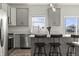 Stylish kitchen featuring a center island, modern appliances and view to the backyard at 1399 Hat Band St, Danville, IN 46122