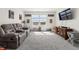 Bright living room with a comfortable reclining sofa, large window, and decor at 1399 Hat Band St, Danville, IN 46122