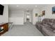 Upstairs living area with plush carpeting, comfortable seating, and open access to other rooms at 1399 Hat Band St, Danville, IN 46122