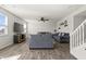 Spacious living room features hardwood floors, a ceiling fan and a staircase at 1399 Hat Band St, Danville, IN 46122
