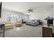Bright main bedroom featuring a king bed, comfortable seating area, and natural light at 1399 Hat Band St, Danville, IN 46122