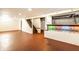 Open basement area with stairs, painted floor and decorative glass block at 14 N Edmondson Ave, Indianapolis, IN 46219