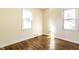 Bedroom features hardwood floors and natural light from two windows at 14 N Edmondson Ave, Indianapolis, IN 46219