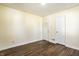 Cozy bedroom features hardwood floors and ample closet space at 14 N Edmondson Ave, Indianapolis, IN 46219