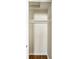 Bright, empty closet features white walls, a wooden floor, and two shelves at 14 N Edmondson Ave, Indianapolis, IN 46219