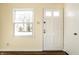 Bright entryway featuring hardwood floors and a view of the outdoors at 14 N Edmondson Ave, Indianapolis, IN 46219