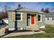 Charming home with a bright orange door and attractive window shutters at 14 N Edmondson Ave, Indianapolis, IN 46219